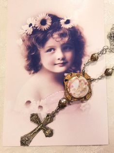 "I love this sweet mixed metal cross necklace. The angel / cherub is a very old vintage porcelain button set in a vintage setting. I found the ITALY cross at a Rome flea market.  They are connected with Swarovski pearls and filigree to create this striking 3 3/4\" long pendant. The antiqued silvertone chain strand hooks on the side and is 15 1/2\" long. If you need a different length please let me know. Our new vintage jewelry makes a great gift for Christmas, a birthday or an anniversary....or Cross Pendant Necklace Woman, Vintage Setting, Angel Cherub, Cross Necklaces, Assemblage Necklace, Vintage Angel, Angel Necklace, Steampunk Necklace, Metal Cross