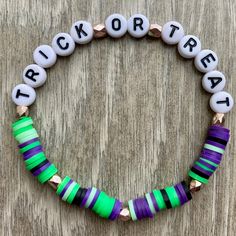 Includes one beaded bracelet with white/black letter beads spelling "Trick Or Treat" with purple, black, and green clay heishi beads and gold spacer accent beads. This bracelet is made using stretchable elastic tied to fit most wrists. Purple Heishi Beaded Bracelets With Letter Beads, Purple Heishi Beads Bracelet With Letter Beads, Green Heishi Bead Bracelet With Letter Beads, Green Heishi Beaded Bracelet With Letter Beads, Disney Friendship Bracelet, Disney Friendship, Heishi Bead Bracelet, Disney Bracelet, Bracelets Ideas