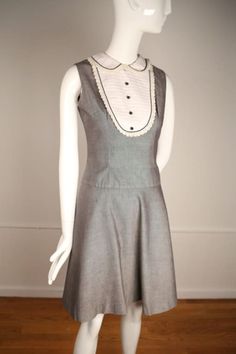 "1960s uniform inspired day dress with shirt details around the collar. The dress falls above the knee with the flared skirt detail and has a center back zipper. Excellent condition with no stains or damages.  Lenth 38\", Chest 34\", Waist 28\", Free Hip: Will fit Small or size 4." Gray Uniform, Dress With Shirt, 1960s Fashion, Flared Skirt, Day Dress, 1960s Vintage, Dress Clothes For Women, Fall Dresses, Above The Knee