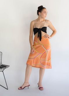 "Vintage 90s abstract silk skirt. Brightly colored abstract silk skirt perfect for the Spring / Summer season! Low-waisted fit. Flowy a-line silhouette. Below knee length. Side hook and eye and zipper fastening. Fully lined. We kindly ask that you please view all measurements for comparison so you can get your desired fit. Made in New York. * Brand: Lafayette New York 148 * Decade: 1990s * Fabric: Silk * Lining: Polyester Crepe * Color: Orange, Lime Green, Pink C O N D I T I O N Excellent vintag Summer Flowy Skirt With Abstract Print, Lafayette New York, Spring Abstract, Fabric Silk, Model Fits, Low Waisted, Silk Skirt, Puff Sleeve Top, Boho Blouses