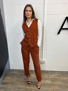 Product: 3 Piece - Jacket, waistcoat and trousers (Pants). Colour: Burnt Orange Product Status: Pre Order Promo Starting with the jacket, it has 2 workable pockets in the front and also a working chest pocket at the front. The closure is a two button closure and the back is double vented. The jacket also has an inside pen pocket and the inside lining is plain black. Moving on to the waistcoat, it consists of two working front pockets, and the closure is a 4 button closure. The back has an adjust Rust Color Pant Suit, Burnt Orange Work Outfit, Burnt Orange Blazer Outfit, Dark Orange Wedding, Orange Pants Outfit Work, Burnt Orange Outfit, Burnt Orange Suit, Gay Prom, Orange Blazer Outfits