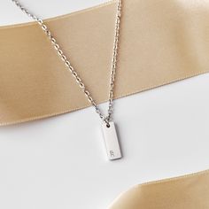 Our tiny personalized rectangle initial necklace is beautiful & perfect for anyone! The rectangle pendant is so dainty, which makes it great for layering, or just everyday wear.❤︎ * * * * * * * * * * * * * * * * * * * * * * * * * * * * * * * * * * * * * * * * * * * * D E T A I L S * All products are handmade. * Materials: 316L Stainless Steel * Chain style: Cable * Pendant: 15 mm X 5 mm * Color: Silver * Make: As shown in picture * Personalization Available * Made to Order * * * * * * * * * * * * * * * * * * * * * * * * * * * * * * * * * * * * * * * * * * * * H O W ∙ T O ∙ O R D E R * Just use the 'PERSONALIZATION BOX' to let us know the engravings and FONT OPTION you would like have on the charm. * The maximum number of characters allowed is 5. (Space, Number and Symbol are all considered Rectangle Pendant, Initial Pendant Necklace, Engraved Necklace, Initial Pendant, Steel Chain, Stainless Steel Chain, Jewelry Plate, Initial Necklace, Chain Styles