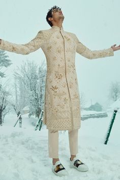 Beige sherwani with 3D applique and hand embroidery with floral and geometrical motifs. Comes with trouser.
Component: 2
Pattern: Hand Embroidered
Type Of Work: Geometric and Floral Patterns
Neckline: Band Collar
Sleeve Type: Full
Fabric: Pure Matka Silk
Color: Beige
Other Details: 
Floral patterns
Occasion: Groom, Wedding - Aza Fashions Unstitched Beige Sherwani With Naqshi Detailing, Beige Sherwani With Resham Embroidery, Beige Sherwani With Resham Embroidery For Transitional Season, Unstitched Beige Sherwani With Zari Work, Designer Cream Fitted Kurta, Traditional Beige Sherwani With Chikankari Embroidery, Reception Sherwani With Dabka Work, Beige Sherwani With Chikankari Embroidery, Unstitched Beige Sherwani With Resham Embroidery