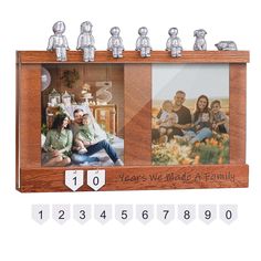 a family photo frame with four photos and numbers on the front, two people are sitting in