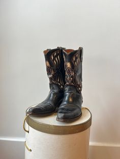 This is a pair of authentic vintage 1950s ACME Thunderbird black cowboy boots. These 50s cutout boots depict a thunderbird with gold, white, & red cut outs and inlays. This 1950's pair of ACME cowgirl boots have black leather pull tabs & leather soles & foot beds. These 50's western boots have a pointy toe & slanted stacked vamp heel. Stamped size 8 D,  Made in U.S.A. They are a Men's 8 or a Women's 9.5 W Full height: 12.5" Heel: 1 3/4" Ball: 4" Toe to heel: 11.5" Against wall: 11" Very good con Black Embroidered Cowboy Boots, Vintage Black Ranch Boots, Vintage Black Boots For Ranch, Vintage Hand-tooled Boots For Western-themed Events, Vintage Black Boots For Rodeo, Acme Boots, Cutout Boots, Old Boots, Black Cowboy Boots