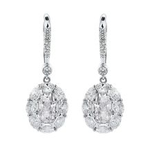 METAL SPECIFICATIONS White Gold 14K STONE SPECIFICATIONS Stone Name : Old Miner Stone Cut : Oval and Round Stone Details : There is one oval cut old miner diamond approx. 1.50 carats (Approx. size 6.5 x 5 mm) and approx. 1.50 carats of smaller diamonds in each earring. Natural earth mined diamonds. Color : F/G Clarity : Sl1 Total : Approx. 6 Carats EARRING SPECIFICATIONS Overall Size (mm): Approx. 16 mm x 9 mm Appraised Value : $20898.00 Comes with Certificate Earth's Mantle, Diamond Dangle Earrings, Oval Earring, Natural Earth, Stone Cuts, Oval Diamond, Stone Names, White Gold Diamonds, Oval Cut