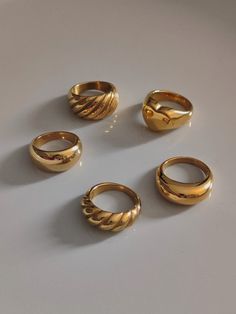 We offer chunky gold rings at affordable prices. Since chunky rings are so popular, I made a special collection for them. Large dome rings, chunky croissant rings, double dome rings, chunky love rings. As a beautiful stainless steel-based gold band, it lasts forever and will always look good. A single ring is stylish enough, but a couple does look very fancy together. ♥ SIGN UP for 10% OFF your first order: https://bit.ly/3olIlWf ♥ DETAILS - Materials: Stainless steel, 18k gold plating. - Nickel Bulky Rings Women, Statement Rings Gold, Gold Chunky Rings Aesthetic, Chunky Jewelry Rings, Gold Thick Ring, Gold Rings Thick, Chunky Gold Rings Vintage, Thick Rings For Women, Classy Gold Rings