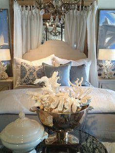 a bed with white pillows and blue decor