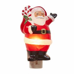 a lighted santa clause figurine on a white background