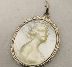 Estate art deco rare one of a kind mother of pearl carved woman set in 14k white gold. chain is 14k white gold also. 18 inchs. great shape. inscribed on back. will pack well. 3.3 grams. Art Deco White Gold Oval Necklace, Vintage Carved White Gold Jewelry, Elegant Engraved Mother Of Pearl Jewelry, Elegant Engraved Mother Of Pearl Necklace, Formal White Gold Carved Jewelry, Formal Oval Intaglio Necklace, White Medallion Jewelry For Formal Events, White Medallion Jewelry For Formal Occasions, Elegant Carved Necklaces For Formal Occasions