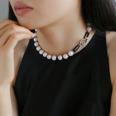 Elevate your outfit with this black spinel and round baroque pearl OT choker that exudes sophistication. This choker is expertly crafted, with stunning black spinel beads and dazzling round baroque pearls creating a harmonious contrast of textures and tones. The adjustable OT clasp ensures a comfortable fit, and the elegant design easily transitions from day to evening, making it a versatile addition to your jewelry collection. Metal: Recycled Sterling Silver Plated On Brass Pearl: Freshwater Baroque Pearls 10-11mm Gemstone: Black Spinel Chain Length: 390mm Weight: 54g Elegant Black Beaded Jewelry, Elegant Black Pearl Necklace For Weddings, Elegant Formal Jewelry With Black Beads, Elegant Black Beaded Jewelry For Formal Occasions, Elegant Formal Black Beaded Jewelry, Luxury Black Pearl Chain Necklace, Elegant Black Beads Choker As Gift, Elegant Black Beads Choker For Gift, Elegant Black Beaded Pearl Necklace