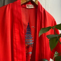 Vintage red robe with embroidery, two pockets, loops. Label: Health Shanghai china, size marked M, check the actual measurements: length 49.5" 125 cm bust-waist 50" 127 cm  sleeve 8" 20 cm shoulders 28" 71 cm Condition: very good, few small spots. Clothing is measured on a flat surface. Please compare the actual measurements with a similar item of your clothing that fits you, and don't forget to leave room for body movement! Please take the time to read the store policy. After making a purchase, Red Open Front Kimono For Summer, Red Open Front Kimono For Spring, Long Embroidered Cotton Kimono, Red Cotton Kimono For Festival, Red Summer Robe With Kimono Sleeves, Traditional Embroidered Open Front Kimono, Red Robe With Kimono Sleeves For Spring, Traditional Cotton Robe With Kimono Sleeves, Red Robe With Kimono Sleeves For Summer