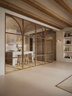 an open living room and dining area with glass doors