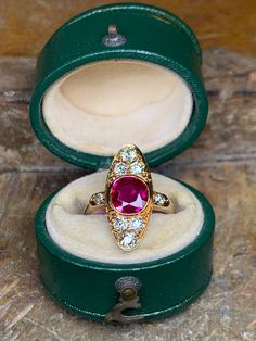 Vintage Ruby and Diamond Ring ~ circa 1950's If you love rubies, this ring would be a lovely addition to your collection. If it is your first ruby, what a wonderful starter option. This pointed oval setting in 14k yellow gold is designed to bring attention to the center genuine ruby stone. The setting is fleshed out with diamonds to bring life to the ruby and add a bit of sophistication. The genuine ruby is quite rich in color while the diamonds add a rich flair and draw the eye. Currently, the Classic Round Ruby Cluster Ring, Formal Art Deco Ruby Ring In Yellow Gold, Yellow Gold Diamond Ring With Rose Cut Ruby, Art Deco Yellow Gold Ruby Ring For Formal Events, Antique Yellow Gold Ruby Ring With Brilliant Cut, Antique Style Brilliant Cut Yellow Gold Ruby Ring, Classic Ruby Ring With 17 Jewels, Yellow Gold Ruby Diamond Ring Stamped 14k, Exquisite Yellow Gold Ruby Ring With Diamond