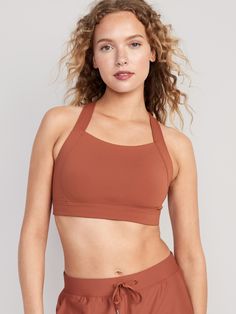 Sports Activewear With Built-in Padding And 4-way Stretch, Sporty Sports Bra With Strappy Back And Built-in Padding, Sporty Strappy Activewear With Built-in Padding, 4-way Stretch Sports Bra With Straps For Gym, Fitted Strappy Nylon Sports Bra, Gym Sports Bra With 4-way Stretch Straps, Sports Bra With Straps For Workout, Strappy 4-way Stretch Sports Bra, Stretch Training Activewear With Straps