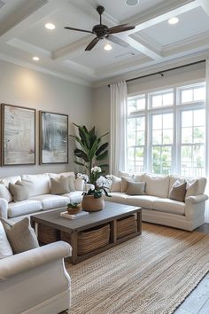 a living room filled with furniture and a ceiling fan in the middle of the room