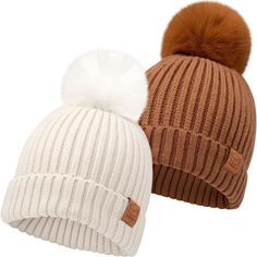 two knit hats with pom - poms on them, one brown and one white