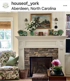 a living room filled with furniture and a fire place in front of a tv mounted above a fireplace