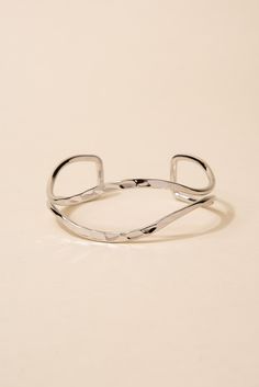 Made from high-quality metal, this bracelet features a unique open eyelid design that is sure to catch the eye. The hammered texture adds an extra dimension of interest to the piece. This cuff is adjustable to fit a variety of wrist sizes, ensuring a comfortable and secure fit. SizeLength: 6.5 in (16.51 cm)Width: 1 in (2.54 cm) Quality Made with a lightweight metal alloy to ensure that the bracelet is easy to wear and that it lasts for longer. Made with a glossy finish that make the bracelets be Trendy Adjustable Open Cuff Bracelet, Adjustable Hammered Cuff Bracelet, Adjustable Hammered Cuff Bangle, Minimalist Adjustable Hammered Cuff Bracelet, Adjustable Minimalist Metal Cuff Bracelet, Adjustable Modern Open Band Bracelets, Modern Adjustable Open Band Bracelets, Modern Adjustable Open Band Bracelet, Adjustable Silver Hammered Cuff Bracelet