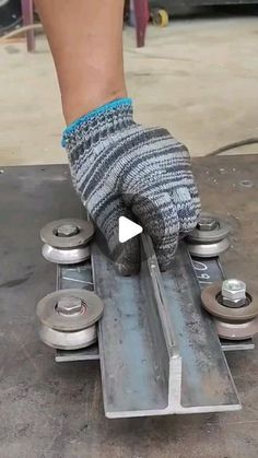 a person wearing gray socks is on a skateboard and has his hand on the wheel