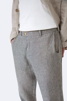 Feel the ease and elegance of the Comfy Classics Linen Pants. These pants have a relaxed fit with belt loops, a zipper, a two-button closure, and ample pocket space. Great for both casual and semi-formal events, they offer a timeless look and breathable comfort. Product Details: * Material: 100% Natural Linen * Fit: Regular * Closure: Zipper and two-button closure * Pockets: Two side pockets and two back pockets * Details: Belt loops for versatile styling * Care Instructions: Machine washable on Summer Tapered Leg Chinos With Belt Loops, Summer Chinos Trousers With Belt Loops, Summer Chinos With Belt Loops, Pockets Details, Mens Linen Pants, Striped Trousers, Mens Linen, Casual Stripes, Pants Casual