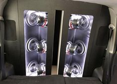 two speakers sitting in the back of a car