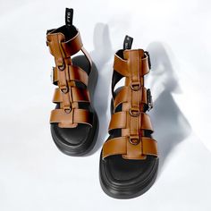 These sandals offer exceptional comfort and style for everyday use. With a lightweight and stable sole, they are ideal for long walks or an active day. The model fits well to the foot and allows adjustment with buckles to ensure maximum comfort. Made from high-quality genuine leather, these sandals are available in a variety of colors, making them perfect for any outfit and occasion. Materials: Genuine leather Sole: Stylish and flat Sole height: front 3 cm / back 5 cm Suitable for: Everyday use Brown Ankle Strap T-strap Sandals With Leather Footbed, Brown Slingback Sandals With Buckle And Round Toe, Spring Brown Sport Sandals With Buckle Closure, Brown Ankle Strap Sport Sandals For Beach, Brown Sport Sandals With Ankle Strap For Beach, Brown Flat T-strap Sandals For Summer, Brown T-strap Footbed Sandals For Summer, Brown T-strap Sandals With Removable Insole For Vacation, Brown Flat Heel Platform Slingback Sandals