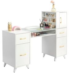 a white desk with gold handles and drawers