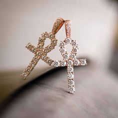 GLD's Rose Gold collection! Known as “The Key of the Nile” the Ankh Cross is one of the most sacred Egyptian symbols representing eternal life, and this bestselling piece is now available in rose gold. We carefully hand-set all stones, executing top craftsmanship. Be assured that no other Ankh will be the same as yours. This product is guaranteed for life – GLD will repair or replace the item should you experience any defects in craftsmanship or breakage. Specifications - 3/4" x 1 3/4" (Width x Luxury Iced Out Rose Gold Jewelry, Rose Gold Iced Out Jewelry As Gift, Rose Gold Iced Out Jewelry For Gift, Rose Gold Cubic Zirconia Cross Pendant, Symbolic Rose Gold Wedding Jewelry, Rose Gold Cross Jewelry With Diamond Accents, Rose Gold Diamond Cross Pendant, Rose Gold Diamond Cross Pendant Jewelry, Spiritual Rose Gold Cross Pendant Jewelry