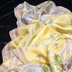 Spectacular Vintage Collectable Lembeck Silk Scarf. Paisley On Yellow Background. The Colors Are Yellow, Blue, Orange, Green,White And A Dash Of Brown. The Hand Rolled Edge Is Exquisite, Following The Pattern Of The Fabric As It Cascades Along The Edge. Very Difficult To Achieve This Edge With Hand Rolling. The Silk Has A Lovely Sheen. This Brand Is Very Difficult To Come By. Excellent Vintage Condition. There Is A Shadow Where Something May Have Gotten On It At Some Point In The Last Picture. L Yellow Scarf, Vintage Silk Scarf, Hand Roll, Yellow Background, Vintage Silk, Yellow Blue, Silk Scarf, Blue Orange, Vintage Collection