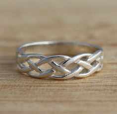 Elegant Solid 925 Sterling Silver Celtic Knot Band Ring.      This is a solid sterling silver ring.       925 stamped.      The ring is 5.5mm wide.      Sizes available: J-T       Approximate weight: 2.0 - 2.3grams depends on size.        Presented in gift boxed.        Thank you for looking! Celtic Knot Band, Celtic Rings, Thumb Ring, Celtic Jewelry, Thumb Rings, Sterling Silver Bands, Celtic Knot, Jewelry Gift Box, Silver Band