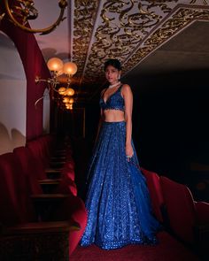 This lehenga set features all over tonal sequin embroidery in a geometric pattern. The ensemble is paired with a strappy blouse and a matching net dupatta.From Seema Gujral’s Night at the Opera collectionDELIVERY TIMEPlease wait 8-12 weeks for your outfit to arrive.FABRIC DETAILSNetProfessional cleaning only. Blue Sequined Party Wear Sets, Designer Blue Sequined Sets, Blue Sequined Pre-draped Saree, Blue Floor-length Sequined Choli, Blue Floor-length Sequined Anarkali Set, Blue Anarkali Set With Sequins For Reception, Blue Sequined Choli For Reception, Blue Sequined Sets For Reception, Blue Sequined Lehenga For Party