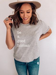 Introducing our new KINDNESS collection! Be a Good Human - Unisex Graphic Tee Designed and printed in the USA. Each shirt is custom printed to order, so please allow for a little extra processing time so we can make sure your shirt is perfect. Printed on Bella Canvas t-shirts. This unisex essential super soft tee fits like a well-loved favorite, quickly becoming your favorite t-shirt you won't want to take off. Size Guide: Tees are UNISEX and fit loose/relaxed. We recommend sizing down for a mor Gray Cotton Slogan Top, Trendy Quote Print Crew Neck T-shirt, Tri-blend Crew Neck Top With Letter Print, Trendy Cotton T-shirt With Quote Print, Gray Cotton Slogan T-shirt, Casual Crew Neck Shirt With Quote Print, Gray Relaxed Fit T-shirt With Slogan, Everyday Crew Neck T-shirt With Quote Print, Relaxed Fit T-shirt With Quote Print For Everyday