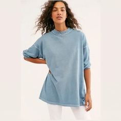 Elevate Your Wardrobe With This Stylish Free People Mock Neck T-Shirt In Blue. This Versatile Piece Features Long Sleeves And A Solid Pattern, Making It Perfect For Any Occasion. The Shirt Is Made From High-Quality Materials And Designed With A Regular Size Type For A Comfortable Fit. The Mock Neck Adds A Touch Of Sophistication To The Basic Style, And The Xs Size Ensures A Flattering Fit For Petite Frames. Whether You're Dressing Up For A Night Out Or Keeping It Casual, This Free People T-Shirt Light Wash Oversized Tops For Everyday, Oversized Light Wash Tops For Everyday, Trendy Blue T-shirt For Fall, Blue T-shirt For Everyday Fall Wear, Relaxed Crew Neck Tops For Layering, Blue Cotton T-shirt For Layering, Oversized Light Blue Tops For Fall, Oversized Light Blue Top For Fall, Relaxed Soft-washed Top With Shirttail Hem