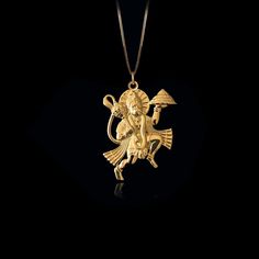 Elevate your faith with our 14k Gold Hanuman Pendant, symbolizing devotion and strength. This solid gold Hanuman necklace captures the essence of the Monkey God. This piece of jewelry is perfect for those seeking a unique and meaningful piece of Hindu faith. PENDANT INFORMATIONThis pendant is made of real, solid gold.• Made in USA• Material: 14k or 18k solid gold• Finish: polished• Height: 1.28" (32,5 mm) x Width: 1" (25 mm)• Pendant weight: approx. 6 grams (14k)• Bail: fits up to 4 mm chains• S Symbolic Gold Jewelry With Large Pendant, Symbolic Gold Plated Necklace With Polished Finish, Symbolic Yellow Gold Necklace With Large Pendant, Yellow Gold Amulet Necklace For Rituals, 22k Gold Symbolic Pendant Necklace, Symbolic 22k Gold Pendant Necklace, Spiritual Yellow Gold Necklace With Polished Finish, Yellow Gold Round Pendant For Rituals, Traditional Yellow Gold Good Luck Necklace