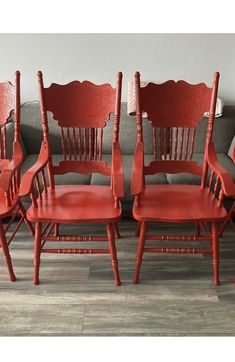 six red chairs sitting next to each other