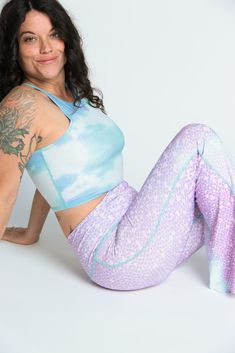 The Teeki Mermaid Tanks are cut with a high neckline and razor back crop top. They can be layered and offer gentle compression for low-impact workouts, yoga, swimming, and everyday layering. Fit: The single layer of lightweight fabric offers a gentle compression for low impact activities and daily use. Move freely in yoga class, by the pool, in the ocean, or layering without the discomfort of tight elastic bands, thick materials and underwires. If you have a small chest size the fit may not be t We Love The Earth, Mermaid Tank, Recycled Water Bottles, Yoga Crop Tops, Love The Earth, Eco Friendly Clothing, Yoga Fashion, Low Impact Workout, Best Leggings