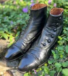 One of many antique shoes we have for sale! A pair of Antique (c1900-1910s) Mens button up boots/shoes. Can be unisex. Jet Black color in a smooth leather fabric. *Refer to last photo and condition comments-see below for notable Issues.  PLEASE REVIEW MEASUREMENTS provided below, and compare to yours, (especially the width of your foot, as well as the length). These antique shoes/boots tend to run very narrow and small. Don't hesitate to ask if I can be of any help. Size: looks like size 10 indicated-but it is always best to refer to measurements when purchasing Antique shoes.  These boots tend to be more narrow than modern, please check your own width and arch carefully.  Measurements: -inner footbed measurement 10.5-10.75" -outer sole length-toe tip to back of the heel is 11.25" Heel hei Antique Shoes, Button Boots, Jet Black Color, Dress Boots, Mens Button Up, Mens Shoes Boots, Colour Photograph, Boots Shoes, Leather Fabric