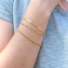 Simple ready to wear modern layering bracelets in 14k Gold filled. ✦ Quantity: 1 chain ✦ Material: 14K Gold filled ✦ Dimensions: 6.5 inches with 1 inch extender Wheat Chain Width: 2.9mm Figaro Chain Width: 2.2mm Flat Chain Width: 2.3mm ✦ Surface: shiny gold Ships next business day. ✦✦ SAVE 15% over $75+ CODE: SAVE15✦✦ Please let us know if you are interested in a higher quantity than what is currently listed. *International customers will be responsible for Import duties, taxes, since these are Modern Everyday Figaro Chain Bracelet, Dainty Bracelet With Figaro Chain Link, Dainty Bracelet With Figaro Chain, Dainty Figaro Chain Link Bracelet, Everyday Figaro Chain Bracelet, Minimalist Gold Bracelet With Figaro Chain As Gift, Minimalist Gold Bracelet With Figaro Chain, Minimalist Gold Figaro Chain Bracelet, Modern Figaro Chain Bracelet As Gift