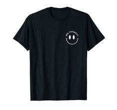 a black t - shirt with a smiley face on it