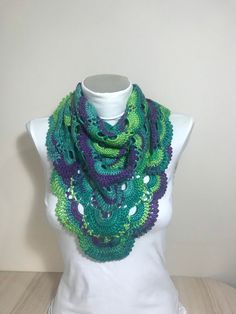 This is a scarf in green,purple and turquoise. Its size is 100x50 cm and 39.5 x 19,7 inches. Green Purple Crochet Scarf/Gifts for her/Scarf for women handmade/Crochet gifts/Crochet scarf handmade/Cheap gifts for friends/Scarf for her Delivery times: North America: 3-5 weeks United Kingdom and EU: 2-4 weeks Asia: 3-5 weeks South America: 4-5 weeks South Africa: 4-5 weeks Australia 3-6 weeks Care Instructions: Hand wash or machine wash in gentle cycle with cold water.Flat air drying is preferred.I Green Bohemian Crochet Shawl, Bohemian Green Crochet Shawl, Purple Crochet Scarves One Size, Purple Crochet Scarf One Size, Handmade Green Bohemian Shawl, One Size Green Crochet Shawl, One Size Purple Crochet Scarf, Purple Crochet Yarn Scarves, Green One Size Scarf As A Gift