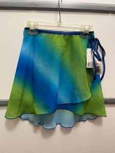 New With Tags BodyWrappers Women's Wrap Skirt, Blue/Green Fade Pattern, Size S/M Adult No Returns or Refunds Blue Lined Swim Skirt For The Beach, Blue Lined Swim Skirt For Beach, Blue Fitted Wrap Skirt For Casual Wear, Fitted Blue Wrap Skirt For Beach, Fitted Blue Wrap Skirt For The Beach, Blue Skirted Skort For Beach, Green Lined Skort For The Beach, Summer Blue Wrap Skirt For Beach, Blue Wrap Skirt For Summer Beach