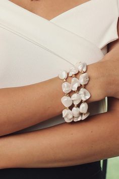 We are over the moon for these organically shaped pearls on our Charlotte Bracelet. Evoking fresh-from-the-sea vibes, this statement bracelet can be from brunch to the beach. With the flexible coils, this bracelet has the added bonus of being effortless to slip on your wrist. Pair with the Charlotte Necklace and Earring or wear solo! Materials: Matte Gold Plated, White Seashell Pearl Size: 8" x 2" Magnetic Clasp Imported Matching Necklace and Earrings Sold Separately Bracelets Clay, Clay Bead Bracelet Ideas, Bead Bracelet Ideas, Clay Bead Bracelet, Ideas Jewelry, Beautiful Bracelets, Trendy Bracelets, Daily Jewelry, Clay Bead