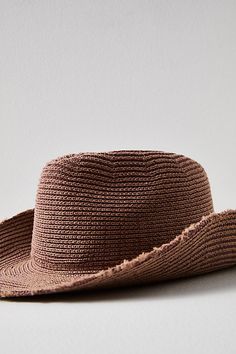 The true definition of an effortless essential, this totally timeless hat is featured in a relaxed cowboy style and woven fabrication for added shape and dimension. **Features:** Relaxed fit, cowboy-inspired style, woven fabrication, raw trim at brim **Why We ❤ It:** Forever cool and classic, this staple hat is sure to be your go-to pick all season long. | Dylan Distressed Cowboy Hat by Free People in Pink Western Style Natural Woven Sun Hat, Western Style Woven Brimmed Hat, Woven Cowgirl Hat, Western Woven Brimmed Hat, Free People Hat, Beige Western-style Woven Straw Hat, Straw Cowboy Hat, Distressed Hat, Cowboy Style