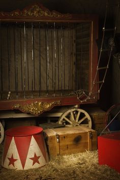 an old timey looking room with many items on the floor and in front of it