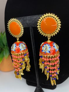 Grab these fun and peppy earrings for a statement look! They come in two colors and are perfect to wear with a dress during the day or a night out as well! Bridal Indian Jewelry, Indian Jhumka, Meenakari Earrings, Bridal Indian, Semi Precious Earrings, Pakistani Bridal Jewelry, Hand Painted Necklace, Simple Bangle, Bridal Choker