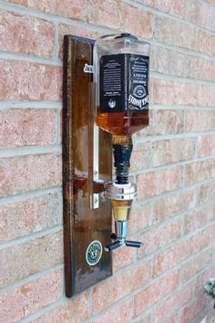 Are you looking for a unique and elegant way to pour your drinks? The Wall dispenser is a beautiful and easy-to-use piece for your wall. Imagine having your favorite drinks on tap and ready to use anytime. This dispenser measures an EXACT SHOT! There are hooks on the back for easy installation. HOW TO USE:Make sure the dispenser is mounted correctly (recommended to be mounted to the wall). Open your bottle of choice and attach it to the dispenser. Once you attach the dispenser flip your bottle and clip it on the wallboard. Once the bottle is clipped, you must push up on the three prongs and your drink will pour. Make sure to watch the video as well!! NOT FOR CARBONATED DRINKS! DIMENSIONS:Height: 20" InchesWidth: 6" Inches Depth: 5" Inches If you are not satisfied with the options listed be Industrial Lights, Chivas Regal, Liquor Dispenser, Burnt Wood, Mounted Bottle Opener, Wall Mounted Bottle Opener, Carbonated Drinks, Home Catalogue, Horse Trailer