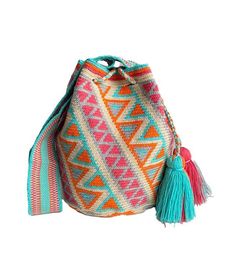 a multicolored bag with tasselled handles