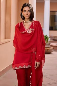 Red kurta with tilla, dori and brass beaded embroidery. Comes with pant and a cape. - Aza Fashions Festive Dabka Embellished Tops, Red Long Sleeve Set With Sheer Dupatta, Red Long Sleeve Sets With Sheer Dupatta, Red Long Sleeve Kurta With Sheer Dupatta, Red Long Sleeve Tops For Eid, Red Blouse With Dupatta For Eid, Festive Red Long Sleeve Palazzo Set, Red Long Sleeve Sets With Dupatta, Red Traditional Blouse With Sheer Dupatta