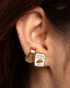 These mismatched earrings are perfectly paired. From sushi to fried rice, soy sauce and rice are a match made in Japanese heaven. Mismatched earring set (1 of each design shown) 2 stud earrings Vibrant, shiny cloisonné enamel Gilded in 22kt gold Hypoallergenic posts Each earring is .5" or slightly smaller Comes in unique, glass vile packaging By Yellow Owl Workshop Black Panther Pin, Soy Sauce Rice, Branded Pins, Mismatched Earrings, 20 Gifts, Artist Gifts, Sticker Patches, Cloisonne Enamel, Match Making